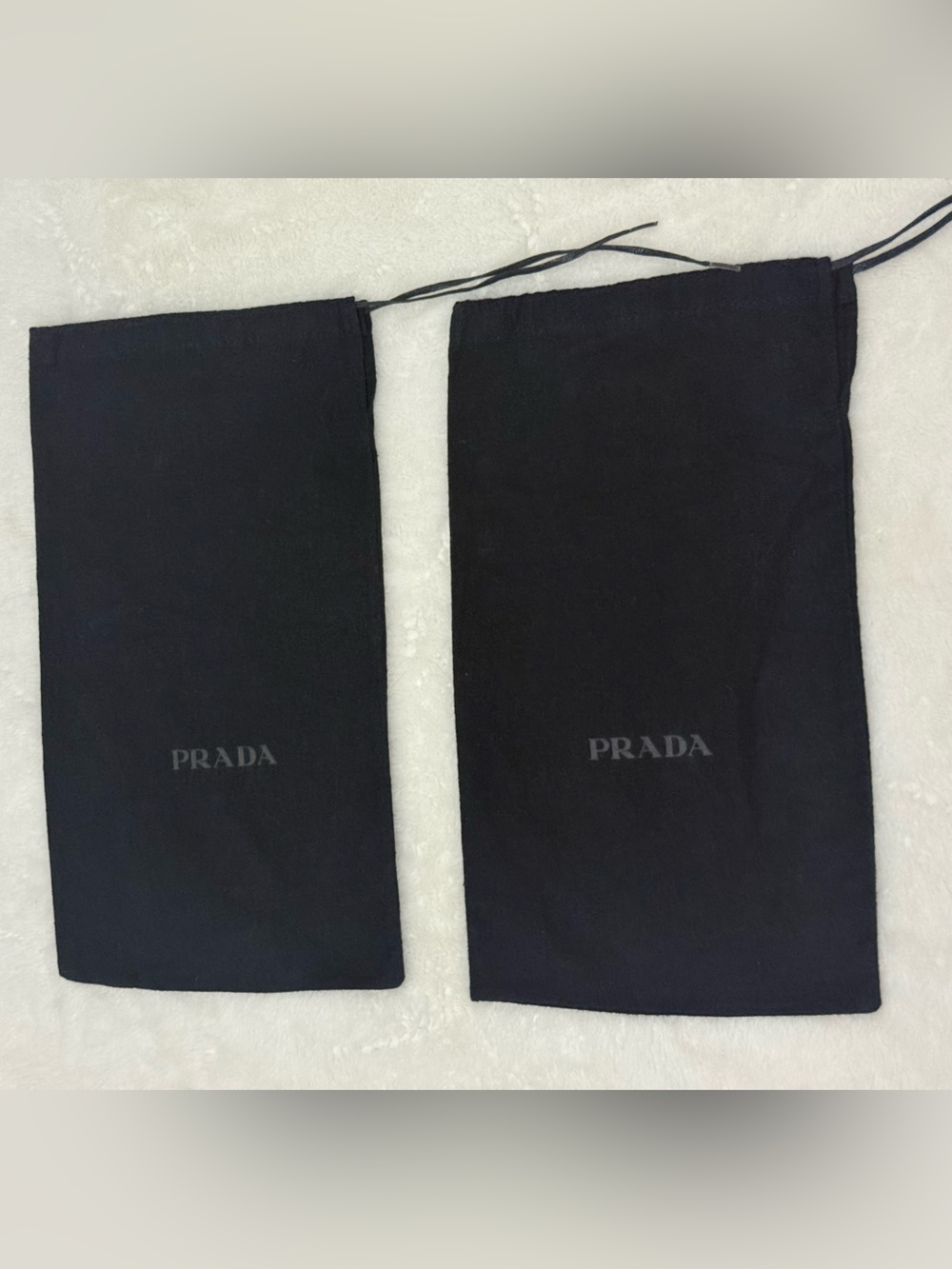 Dark navy Prada dust bags